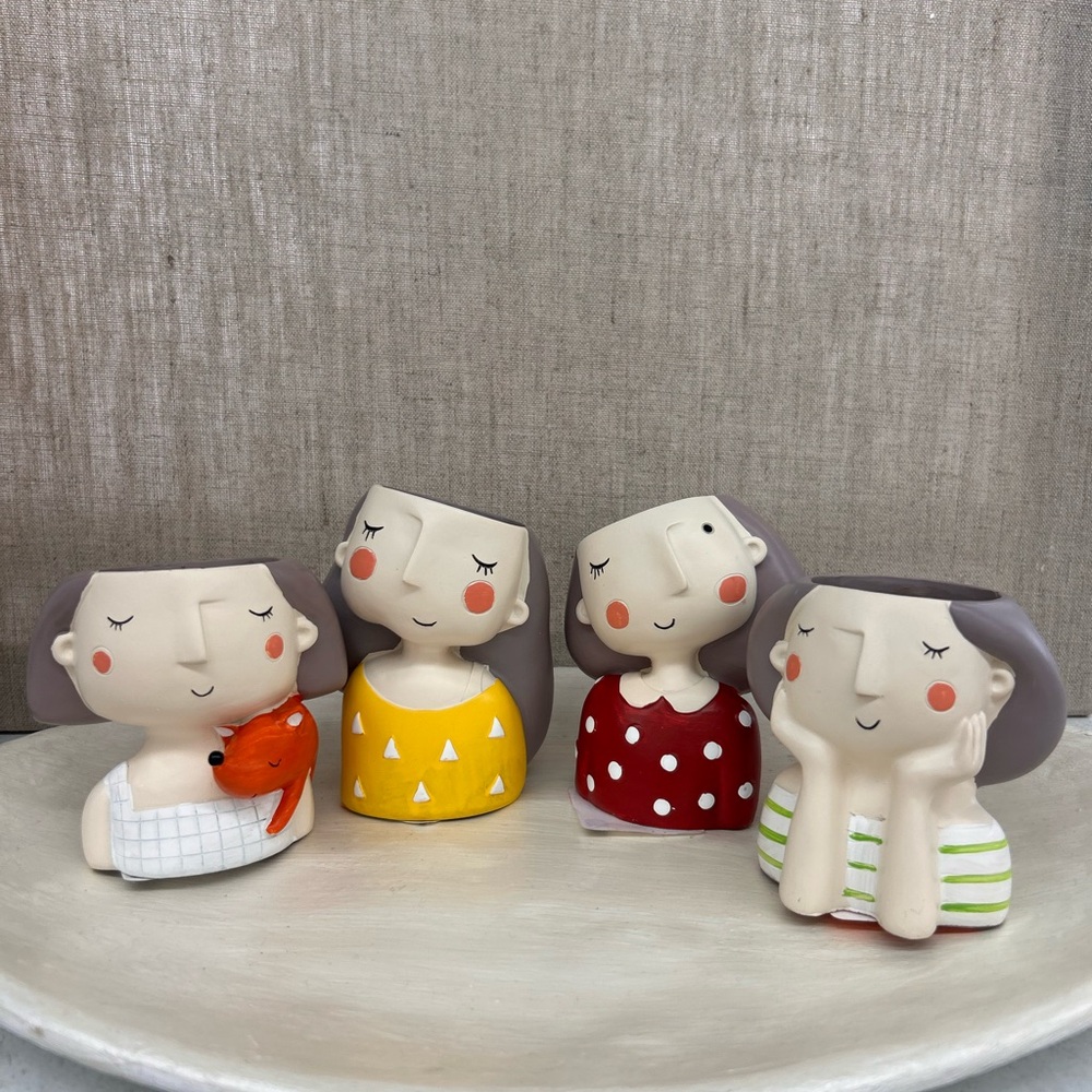 Ceramic Girl Planters. All four
